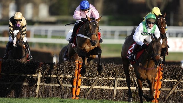 Captain Conan (blue cap) - took advantage of Colour Squadron (green cap) drifting on the run-in to win the Tolworth Hurdle