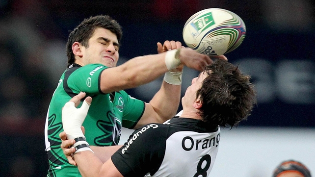 Tiernan O'Halloran contests the ball with Louis Picamoles