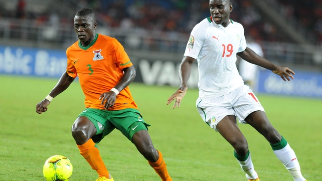 Zambia's Chisamba Lungu (l) shields the ball from Senegal star Demba Ba