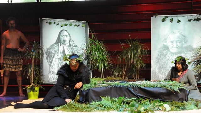 Maori heads are covered up by a black fabric during the restitution ceremony to New Zealand 