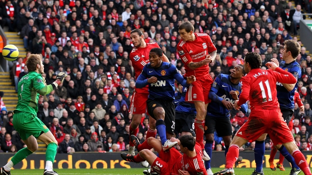 Daniel Agger rises highest to head home the opening goal at Anfield