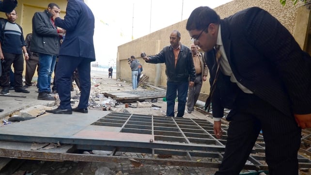 An Egyptian investigation team inspects damages at the Port Said Stadium