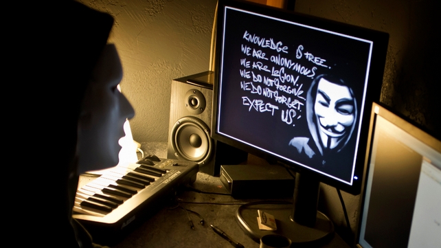 A masked hacker, part of the Anonymous group, hacks the French presidential Elysee Palace website on 20 January A masked hacker, part of the Anonymous group, hacks the French presidential Elysee Palace website on 20 January