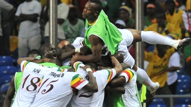 Mali players celebrate after their penalty shoot-out victory in Libreville