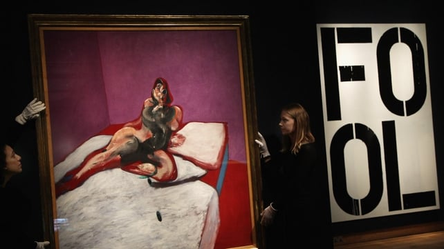 Christie's auction house employees hang a 'Portrait of Henrietta Moraes' by Francis Bacon Christie's auction house employees hang a 'Portrait of Henrietta Moraes' by Francis Bacon