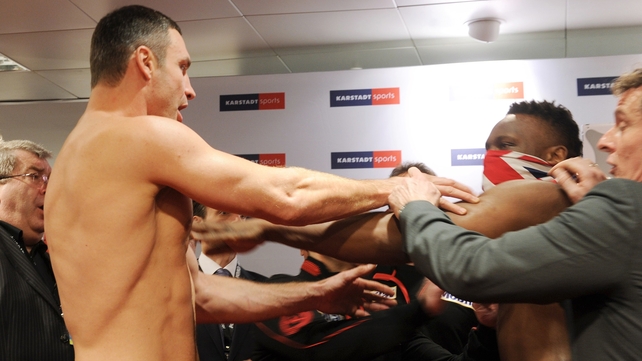 Vitali Klitschko reacts to Dereck Chisora's slap in the face