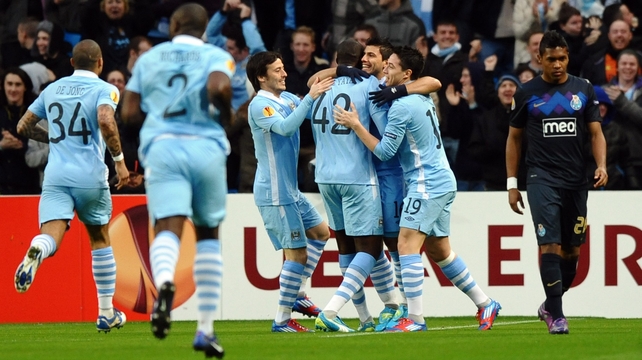 Man City players celebrate Sergio Aguero's opening goal en route to knocking holders Porto out of the Europa League