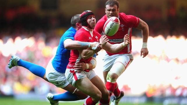 Leigh Halfpenny of Wales is tackled by Sergio Parisse of Italy