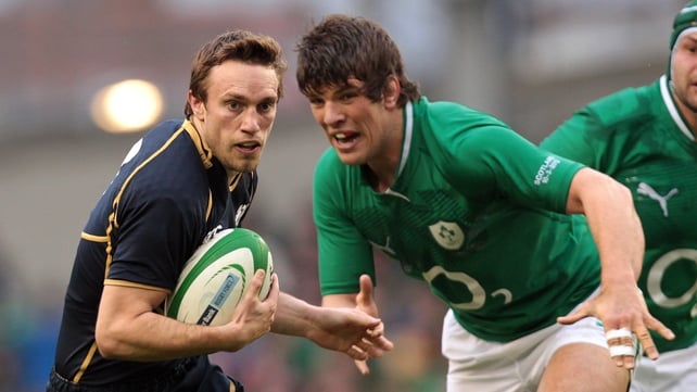 Donncha O'Callaghan chases down Scotland's Mike Blair