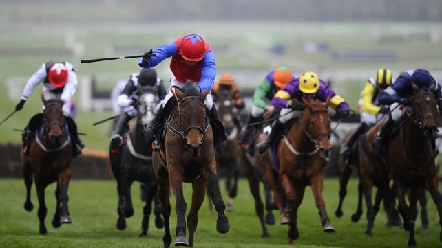 Quevega (red & blue on left) surges clear with Ruby Walsh in the saddle