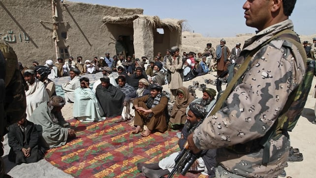 Afghan men at a memorial service for the 16 slain villagers Afghan men at a memorial service for the 16 slain villagers