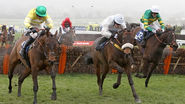 Cape Tribulation ridden by Denis O'Regan (centre) beats Catch Me ridden by Tony McCoy (right) and Cantlow ridden by Dominic Elsworth (left) in the Pertemps Final