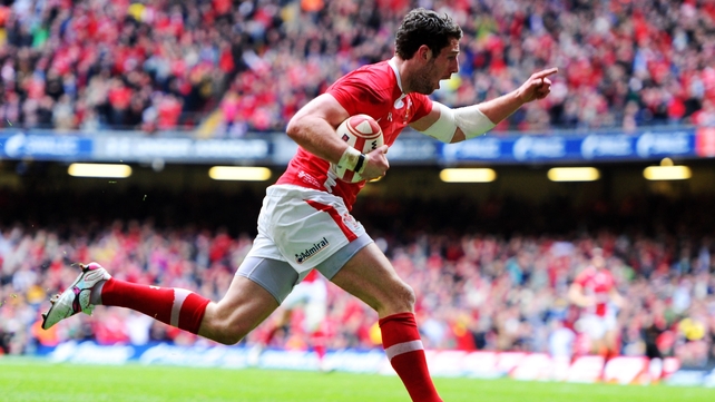 Alex Cuthbert runs in the only try of the Grand Slam decider in Cardiff