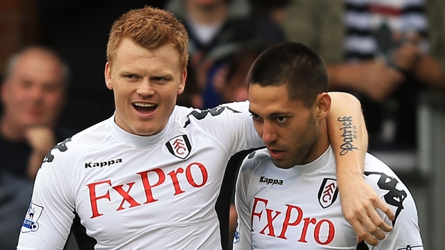 John Arne Riise (L) congratulates Clint Dempsey, who scored the opener for Fulham