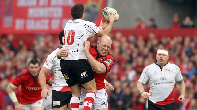 Munster captain Paul O'Connell tackles Ulster out-half Ian Humphreys