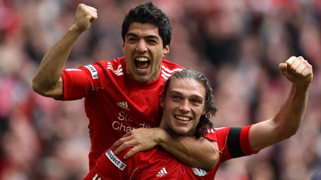 Luis Suarez, scorer of Liverpool's opener, celebrates with Andy Carroll, whose header earned his side a spot in the FA Cup final