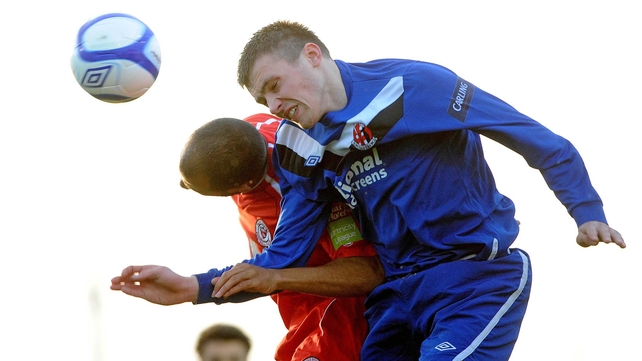 Sligo's Romauld Boco (L) and Crusaders' Stuart Dallas