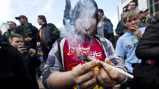 Protesters smoke marijuana during a demonstration against new government legislation calling for the creation of a 'cannabis card' Protesters smoke marijuana during a demonstration against new government legislation calling for the creation of a 'cannabis card'
