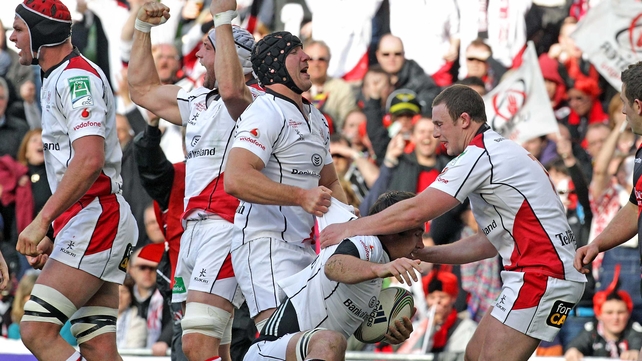 Ulster players celebrate team-mate Pedrie Wannenburgs' try