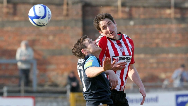 Derry's Ruairdhi Higgins climbs above John Russell at The Brandywell
