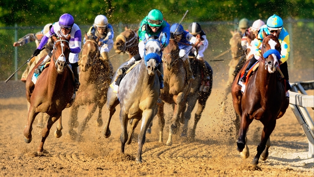 Eventual winner and Kentucky Derby champion I'll Have Another (left) begins his move at the top of the stretch