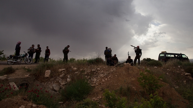 Syrian rebels take positions as they prepare to attack Assad's forces Syrian rebels take positions as they prepare to attack Assad's forces