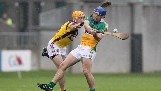 Brian Carroll comes under pressure from Wexford's David Redmond