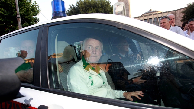 Police escort: The ever-popular Giovanni Trapattoni had to be driven away from the maddening crowd