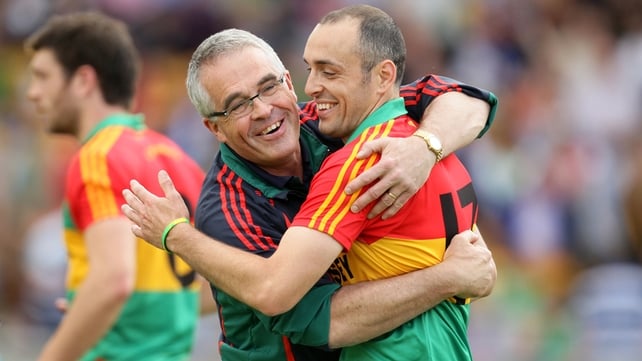 JJ Smith is congratulated by Carlow manager Luke Dempsey