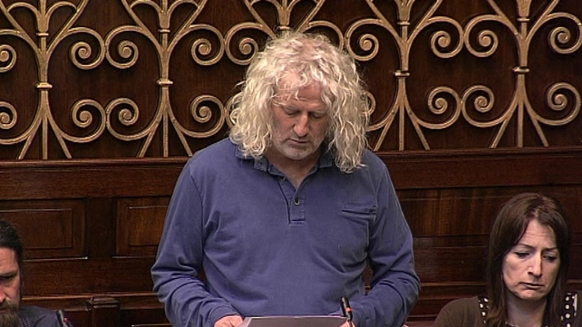 Mick Wallace (centre) and Clare Daly (right) were arrested by airport police at Shannon Airport Mick Wallace (centre) and Clare Daly (right) were arrested by airport police at Shannon Airport