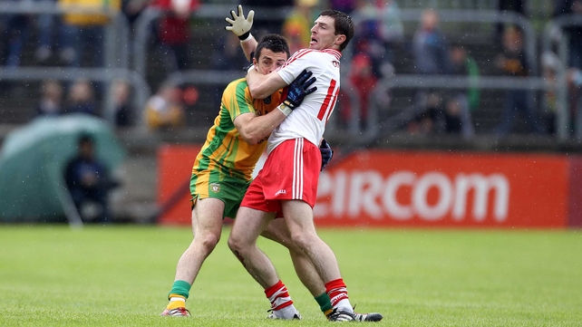 Donegal's David Walsh with Gerard O'Kane of Derry