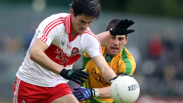Donegal's Paddy McGrath with Chrissy McKaigue of Derry