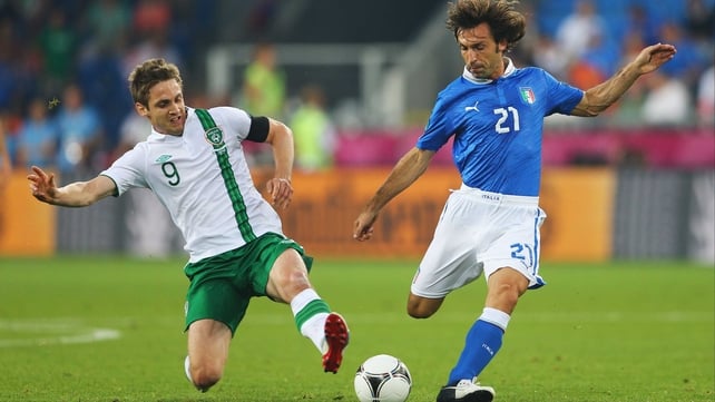Kevin Doyle and Andrea Pirlo clash