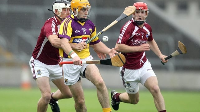 Wexford's David Redmond with Paul Greville of Westmeath