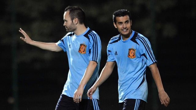 Andres Iniesta (L) and Pedro Rodriguez at the end of a training session yesterday
