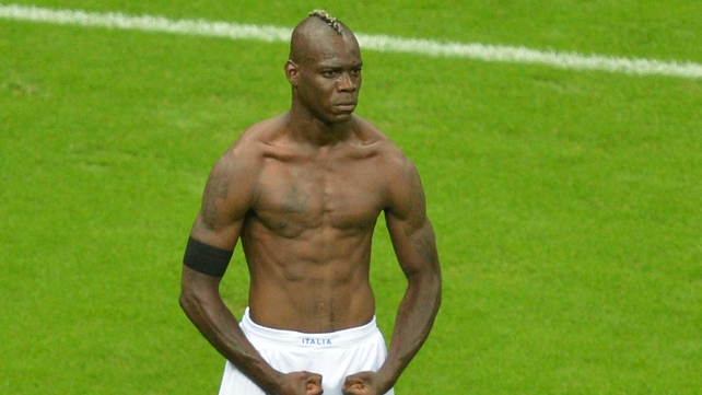 Mario Balotelli celebrates his second goal against Germany
