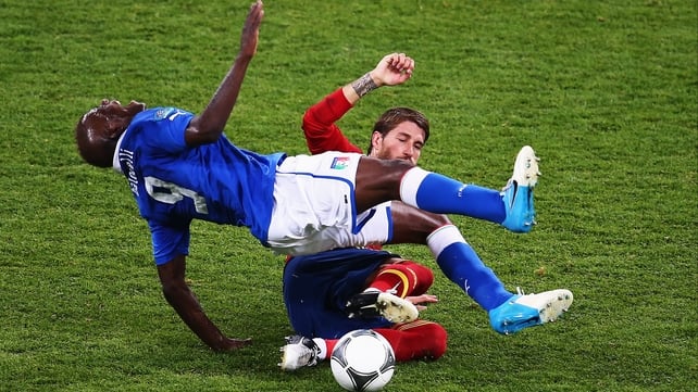 Mario Balotelli feels the effects of Sergio Ramos' tackle
