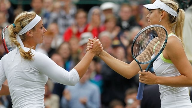 Maria Sharapova (r) congratulates Sabine Lisicki of Germany after the match