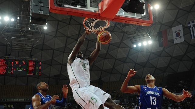 Olumide Oyedeji (centre) of Nigeria scores against Dominican Republic