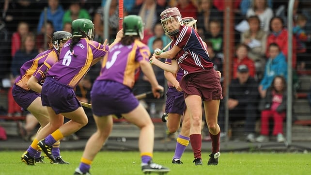 Aislinn Connolly gets her strike away under pressure from three Wexford players