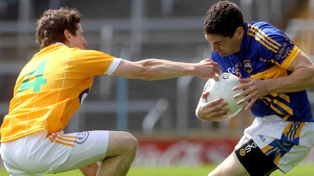 Tipperary's Philip Austin is tackled by Kevin O'Boyle