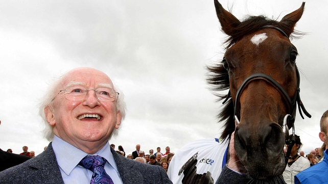 President Michael D Higgins and Oaks winner Great Heavens pose for the cameras