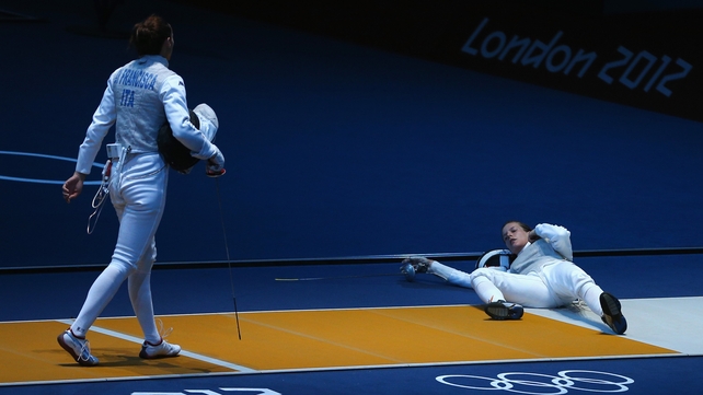 Germany's Carolin Golubytskyi lies prone after being struck by eventual gold medallist Elisa Di Francisca
