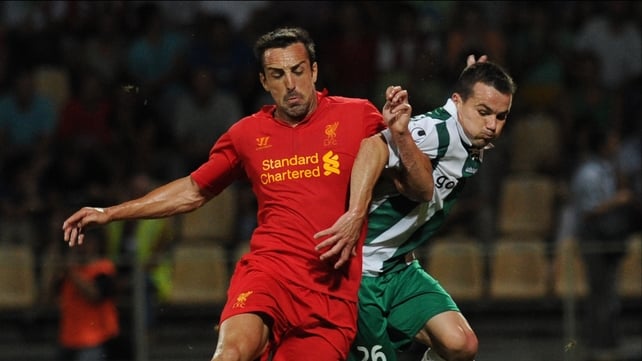 Jose Enrique (L) of Liverpool vies with Gomel's Tomasz Novak for posession