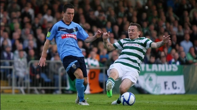 UCD's Tyrone McNeils is challenged by Gary McCabe of Shamrock Rovers