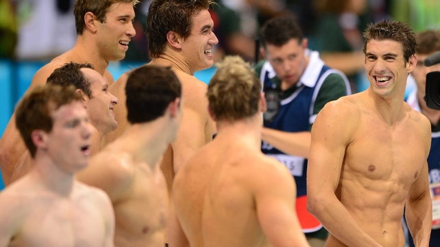 Phelps (r) and the rest of the relay squad celebrate their victory