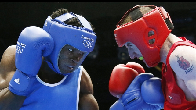 Thomas Essomba (l) in action against Paddy Barnes of Ireland