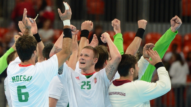 Hungary's pivot Szabolcs Zubai (centre) celebrates with team-mates