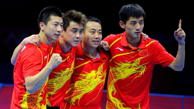Ma Long, Wang Hao, coach Liu Guoliang and Zhang Jike of China celebrate defeating Korea to win the men's team table tennis gold medal match