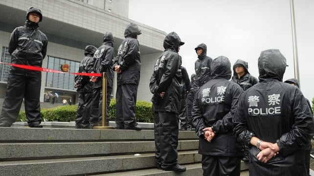 Police stand guard the outside the Intermediate People's Court in Hefei Police stand guard the outside the Intermediate People's Court in Hefei